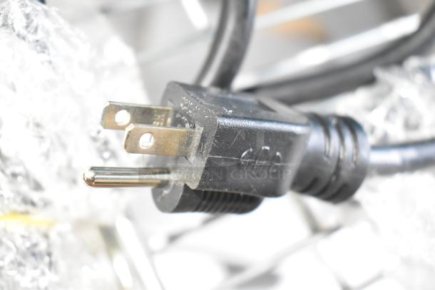 Close-up of power plug for Avantco 177PG400T Panini Grill. Visible scratches; part of a new, scratch and dent listing.