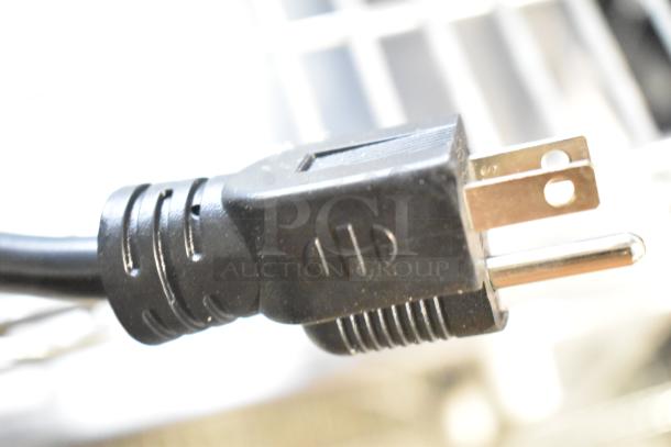 Close-up of power plug for Avantco 177PG400T Panini Grill. 120 Volts, 1 Phase. Durable black plastic construction.