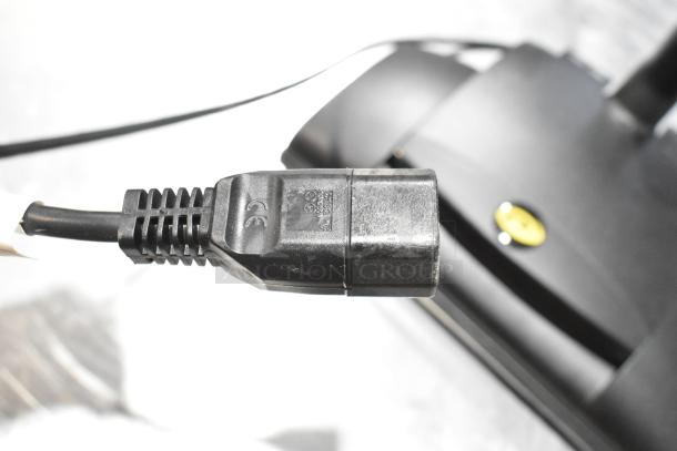 BRAND NEW SCRATCH AND DENT ProTeam 1076770 GoFit 6 PH Backpack Vacuum. Close-up of power cord and unit. 120V, 1 Phase.