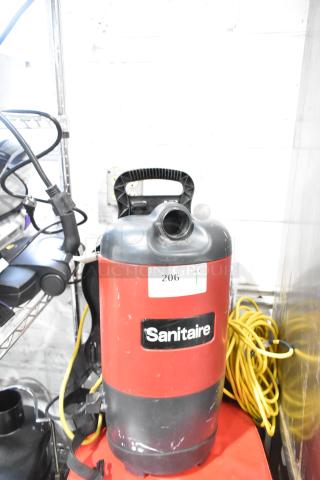 Sanitaire SC412B Backpack Vacuum, red with label, 120 volts. New scratch and dent condition. Model SC412B visible.