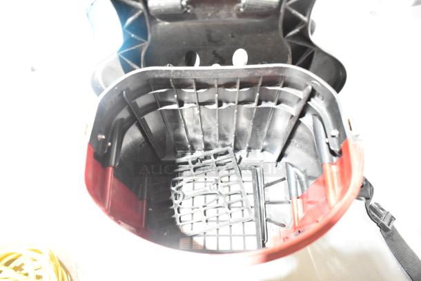 Sanitaire SC412B backpack vacuum interior, black and red components visible. Brand new, scratch and dent condition.