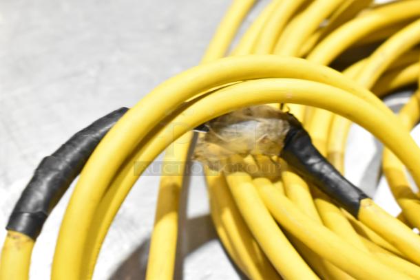 Yellow electrical cord with black tape repairs, showing signs of wear. Suitable for Sanitaire SC412B Backpack Vacuum.