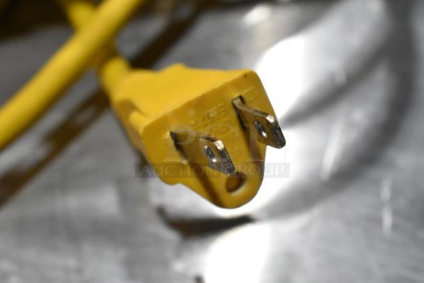 Close-up of yellow power plug for Sanitaire SC412B backpack vacuum. Brand new condition, 120 volts, 1 phase.