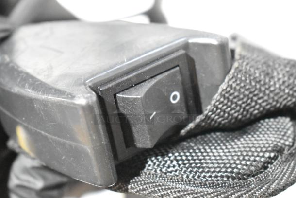 Sanitaire SC412B Transport QuietClean Backpack Vacuum, brand new, close-up on/off switch, 120 Volts, visible scratch/dent.