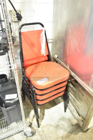 Set of 4 black metal dining chairs with red cushions. Brand new, minor scratch and dent. Lot tag 207 visible.