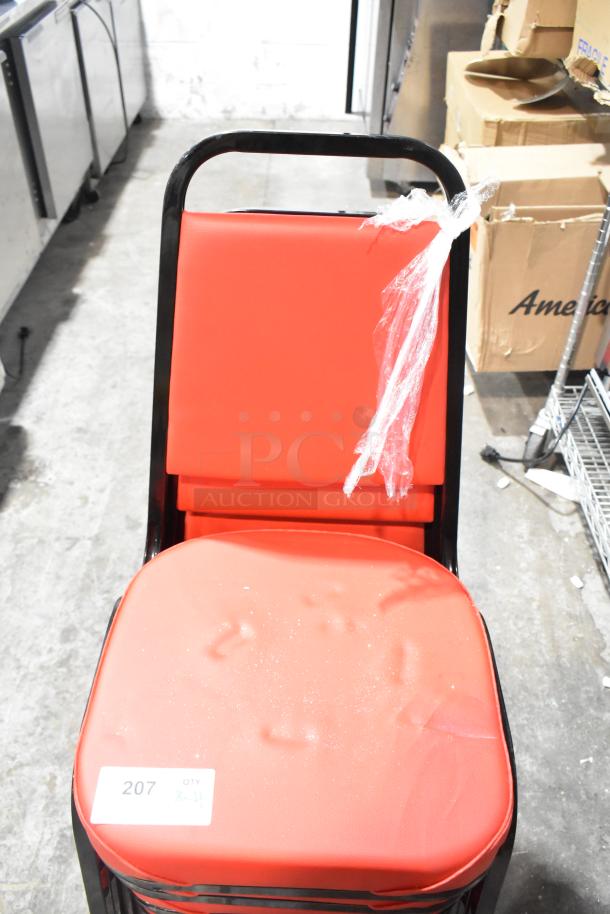 Brand new black metal dining chair with red cushion, includes minor scratches and dents. Sale tag shows "207, QTY x4".