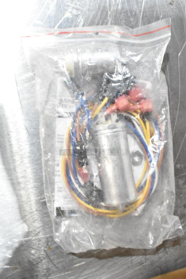 Bagged gas kit with colorful wiring visible, labeled "089-010833-45." Includes restraining cable and Hanning motor. New condition.