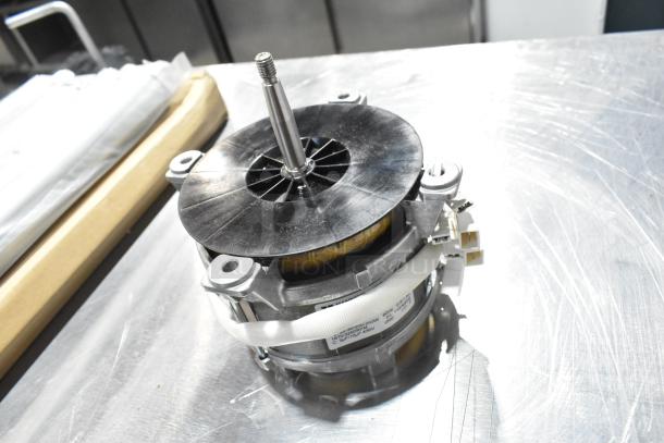 Brand new Hanning motor with visible labels, part of a scratch and dent auction lot including gas kit and cable.