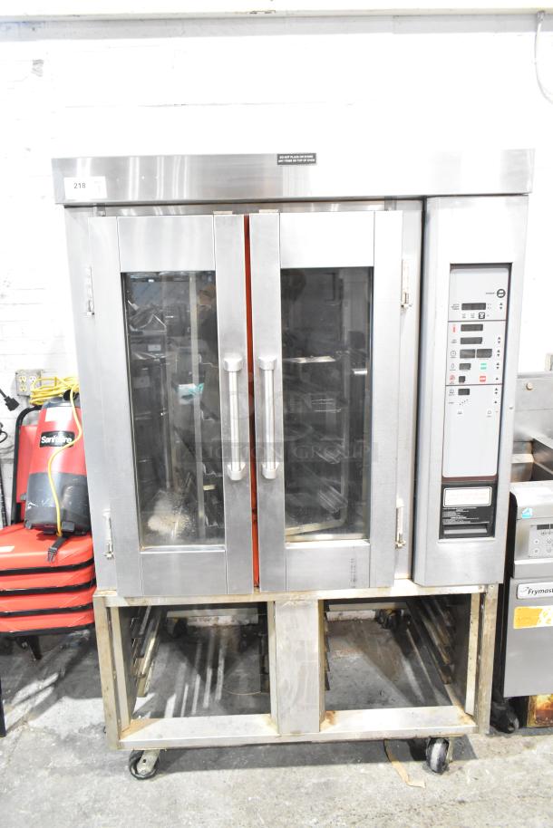 Baxter stainless steel commercial rotating rack oven, natural gas powered, 95,000 BTU, on double pan rack with casters.