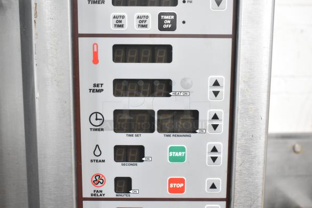 Control panel of Baxter stainless steel commercial rotating rack oven, displaying temperature and timer settings.