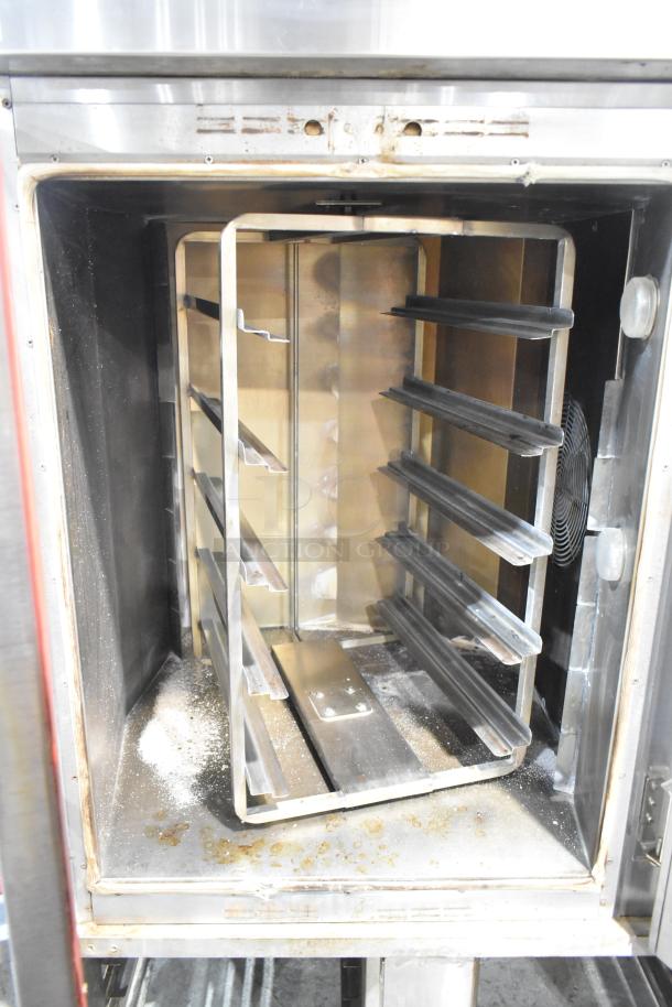 Baxter stainless steel commercial mini rotating rack oven, natural gas powered, 95,000 BTU with double pan rack and casters.