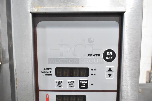 Baxter stainless steel commercial mini rotating rack oven control panel featuring an on/off timer and power button.