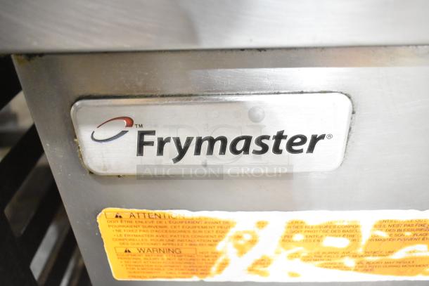 Frymaster FPGL230 stainless steel commercial deep fryer with natural gas power, 75,000 BTU, dual bay, warning labels visible.