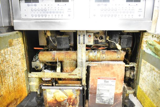 Frymaster FPGL230 stainless steel 2-bay deep fat fryer, natural gas powered, 75,000 BTU, visible wear and rust.