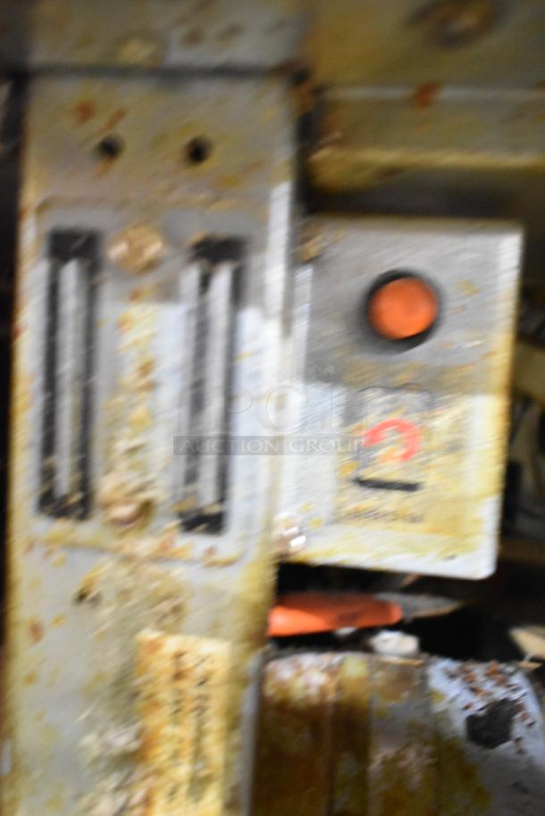 Frymaster FPGL230 deep fat fryer control panel with wear, showing buttons and dials. Model number partially visible.