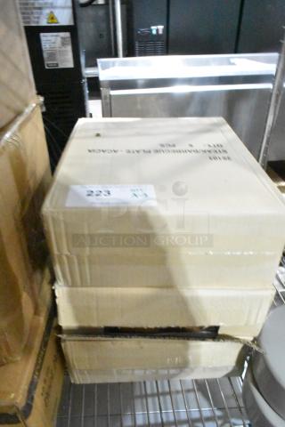 Three sealed boxes of Ironwood Gourmet 13" Acacia Serving Boards, model 28101, labeled "Scratch and Dent" condition.