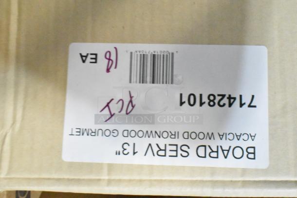 Three boxes labeled 28101 Ironwood Gourmet 13" Acacia Serving Board, condition marked as scratch and dent.