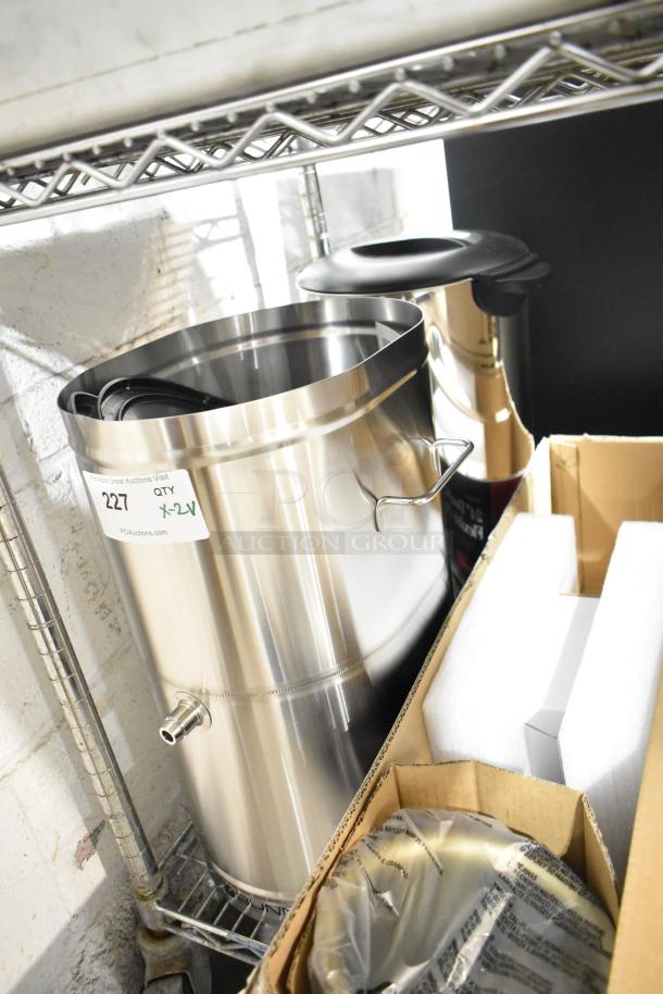 Stainless steel Galaxy 100 cup coffee urn and Bunn beverage holder, new condition, with minor scratches.