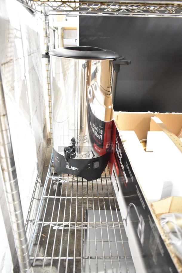 Brand new Galaxy 100 Cup (510 oz) stainless steel coffee urn, single wall, 120V, 1,500W, shown on a shelf.