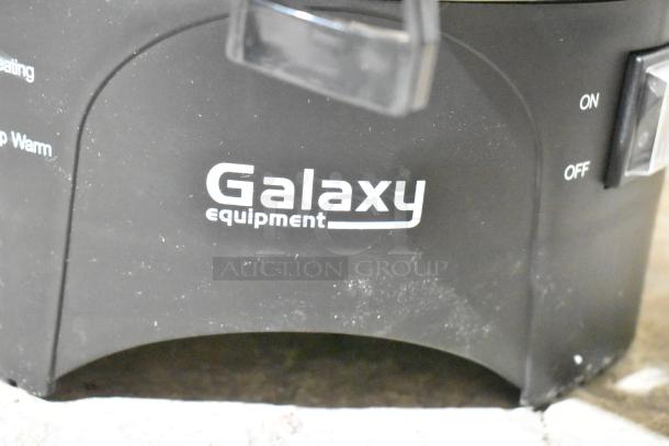 Galaxy Equipment coffee urn, black base with "Galaxy equipment" logo, visible on/off switch.