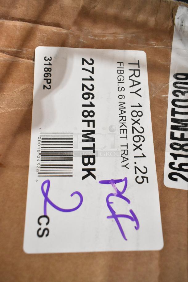 Label showing Carlisle 2618FMTBK specs for black 18"x26"x1" fiberglass trays, boxed 6 per case, marked scratch and dent.