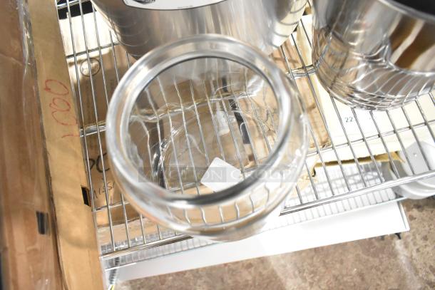 Set of 6 new scratch and dent items, including Anchor Hocking Montana jar and Vollrath Wearever stock pot, on a metal shelf.