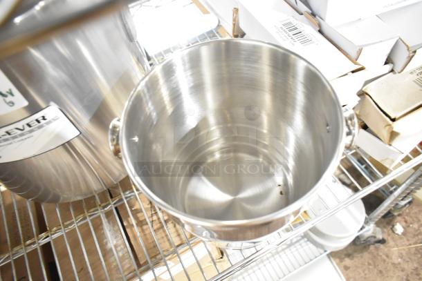 Brand new Vollrath Wearever Stock Pot, stainless steel, on wire shelf. Some packaging visible.