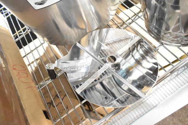 Stainless steel Vollrath Wearever stock pot on wire rack, includes Anchor Hocking Montana jar; scratch and dent items.