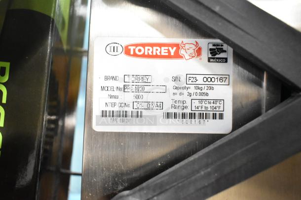 BRAND NEW 2023 Torrey PPC-10/20 20 lb. Digital Portion Control Scale with remote indicator and foot pedal. Scratch and dent condition. Serial No: F23-000167, capacity: 10kg/20lb.