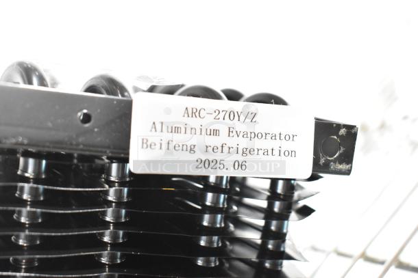 Alt text: "Brand new ARC-270Y/Z evaporator coil, aluminum construction, Beifeng refrigeration, slight scratches visible, 2025 model."