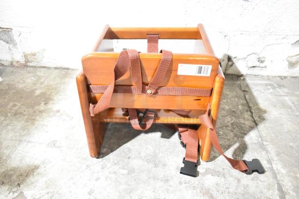 BRAND NEW GET BS-200-MOD-W2 walnut wood booster seat with T-strap. Visible barcode label. Scratch and dent condition.
