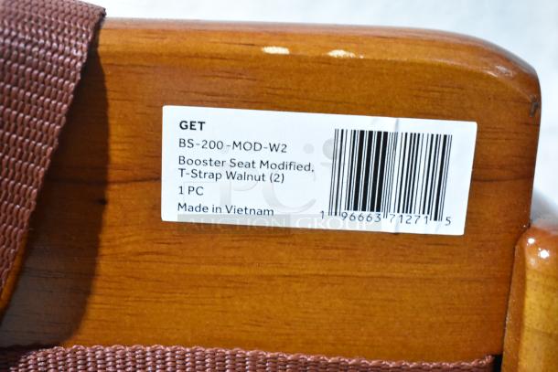 BRAND NEW SCRATCH AND DENT! GET BS-200-MOD-W2 walnut wood booster seat with T-Strap; tag shows model and made in Vietnam.