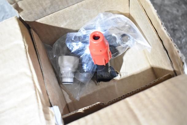 Box containing new scratch and dent items, including a VitaMix piece and plates, with visible red and white parts.