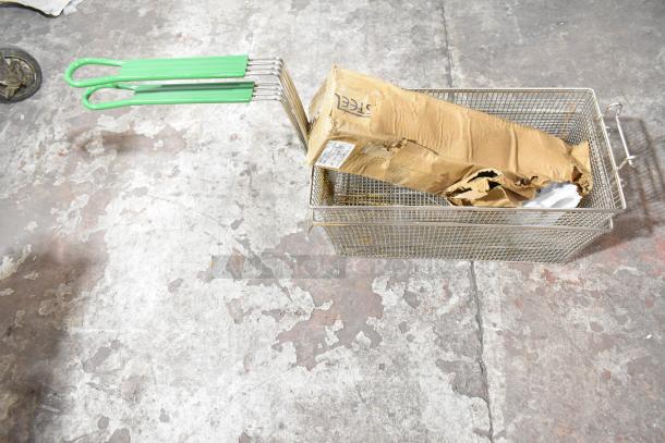 Metal basket with green handles containing a damaged cardboard box. Includes 3.5 oz Choice paneled sherbet dish, scratch and dent condition.