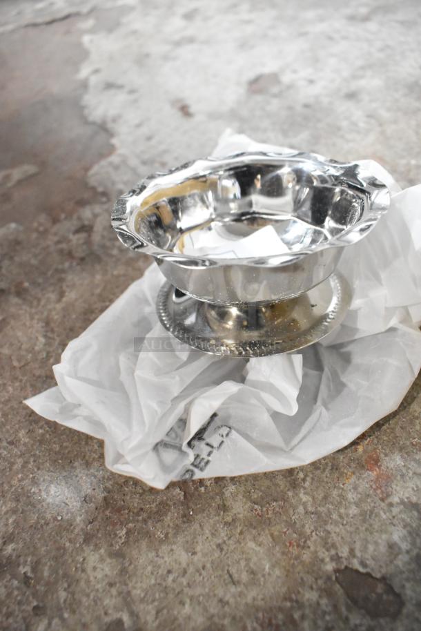 Brand new Choice 17648013 3.5 oz paneled sherbet dish, metallic finish, minor defects, on crumpled paper.
