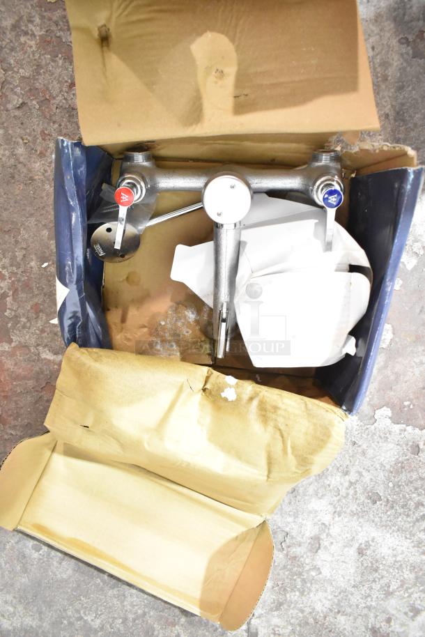 Brand new Waterloo 750FMS8 mop sink faucet, wall-mounted with 8" centers, in original packaging, minor box damage.