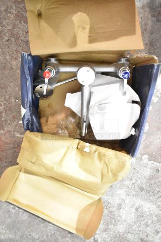 Brand new Waterloo 750FMS8 mop sink faucet, wall-mounted with 8" centers, in original packaging, minor box damage.