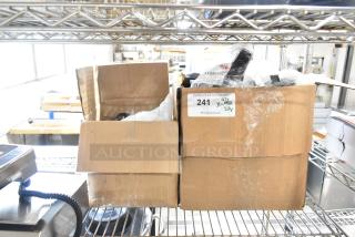 Boxes containing 27 brand new scratch and dent items, including 5" casters for tables and ranges.