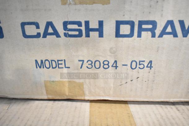 Alt text: New M-S 73084-054 cash drawer box, featuring model number and product label, condition shown as pristine.