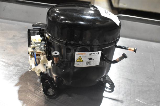 Brand new Cubigel NPY12LR motor, 115-127V, 1 phase, black casing. Label shows model and voltage details.