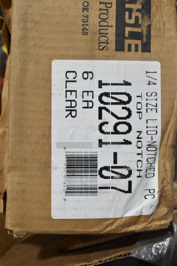 Cardboard box labeled "Carlisle Products" containing brand new Vollrath 4780912 tongs, scoopers, and dippers.