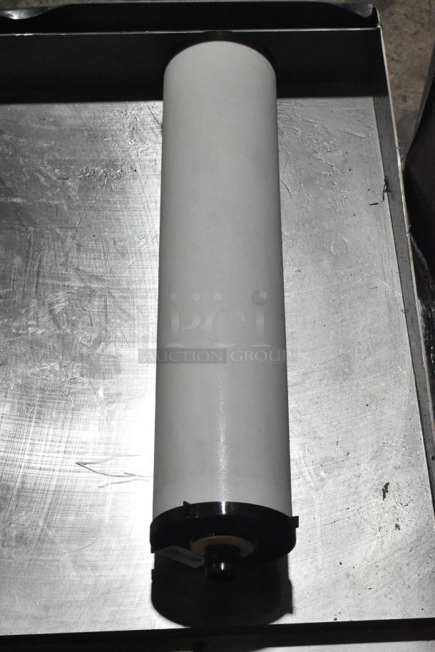 Brand new Selecto Scientific 424139330334 filter, cylindrical shape, pristine condition, on metal surface.
