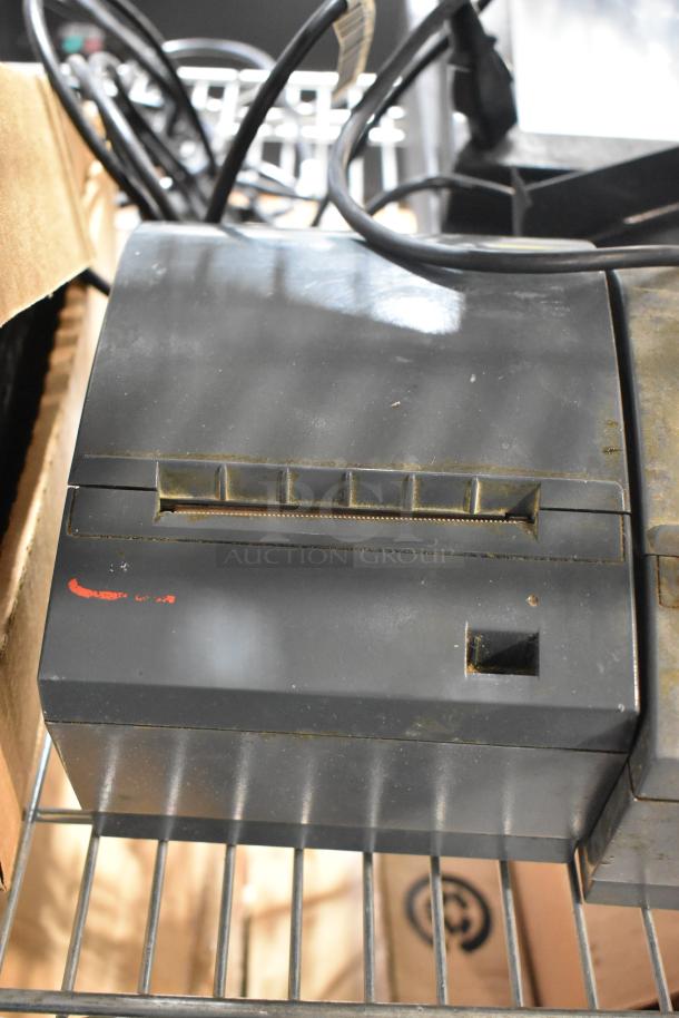 POS receipt printer, black, with wires, visible signs of wear. Auction includes 7 various POS items.