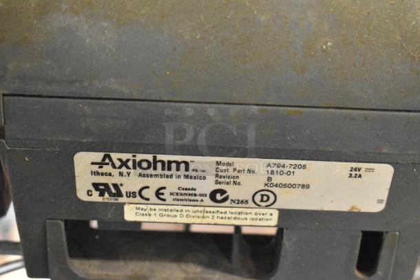 Close-up of Axiom label on a POS device. Model A794-7205, assembled in Mexico, 24V, 3.2A. Serial No. K040500789.
