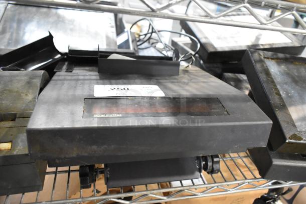 Auction lot including POS monitors and receipt printers. Visible brand: SICOM SYSTEMS. Condition: used, metal rack display.