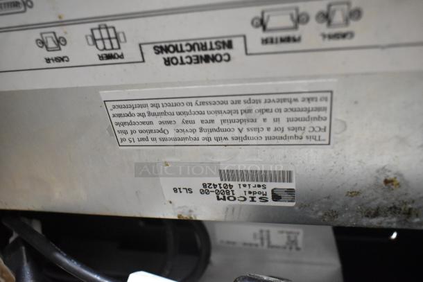 SICOM model 1800-00 serial 40428 label on electronic device, showing connector instructions, signs of wear.