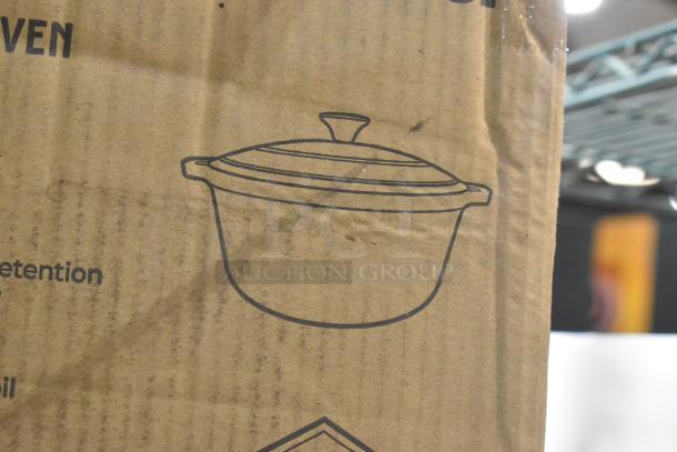 Cardboard box with an illustration of the Mueller DuraCast 6 quart enameled cast iron Dutch oven, new condition.
