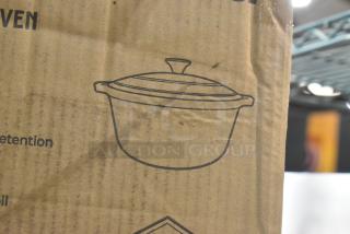 Cardboard box with an illustration of the Mueller DuraCast 6 quart enameled cast iron Dutch oven, new condition.