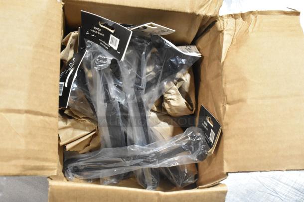 Cardboard box containing brand new Lavex 712SSSD40VL stainless steel soap dispenser and RHGB Group Brushes, packaged with tags.