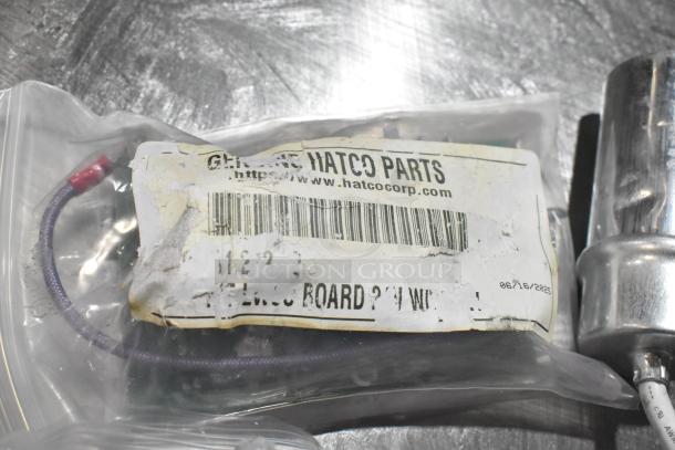 4 new items including KAS1094-000012 hydraulic door closer. Visible Hatco label with barcode and wire in sealed bag.